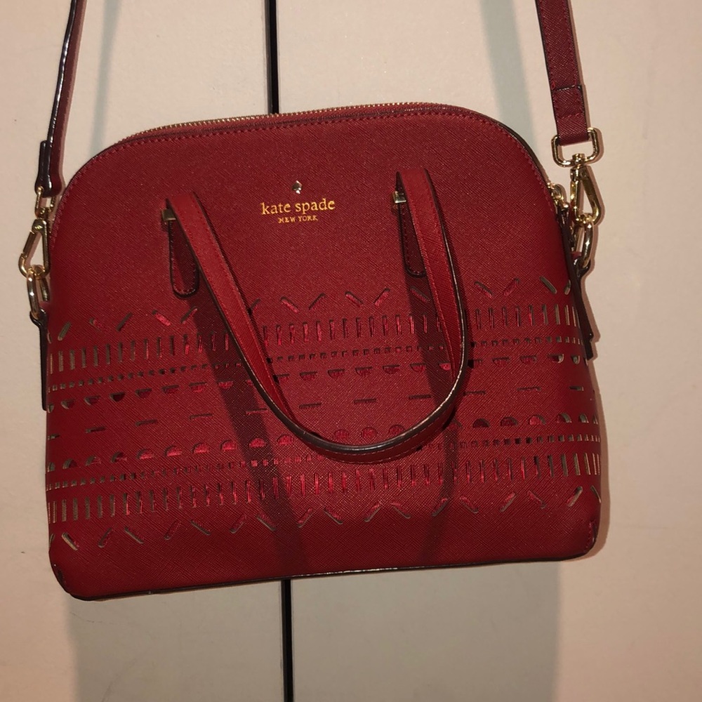 Kate Spade Red bag with cutout pattern